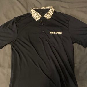 Blue polo shirt with floral design